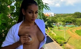 exotic-amateur-babe-showing-off-big-round-tits-outside